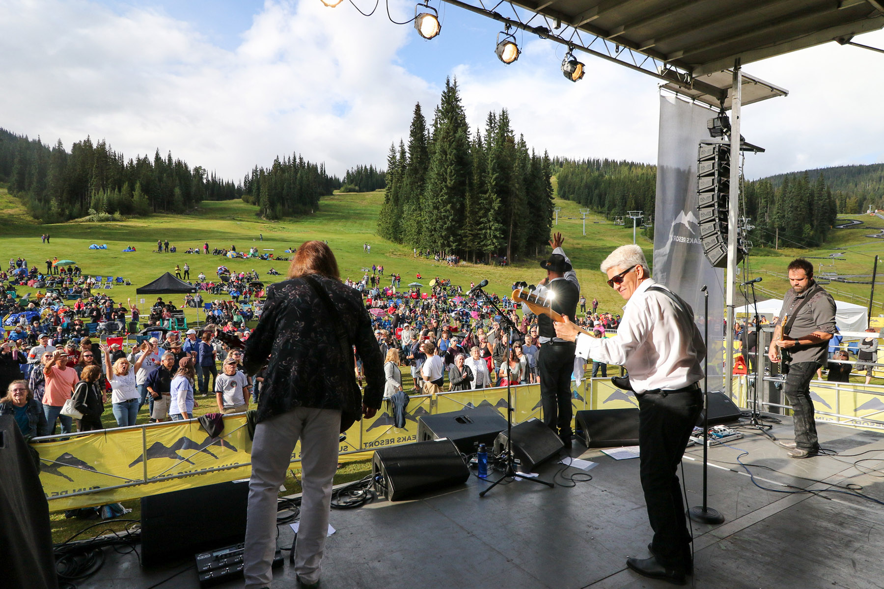 summer concert on slope-side stage in sun peaks