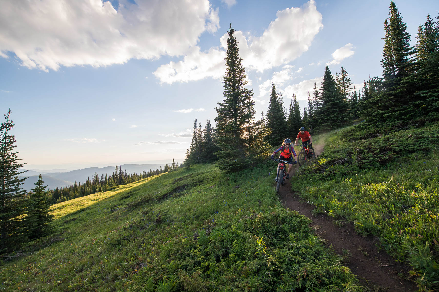 friends biking in sun peaks