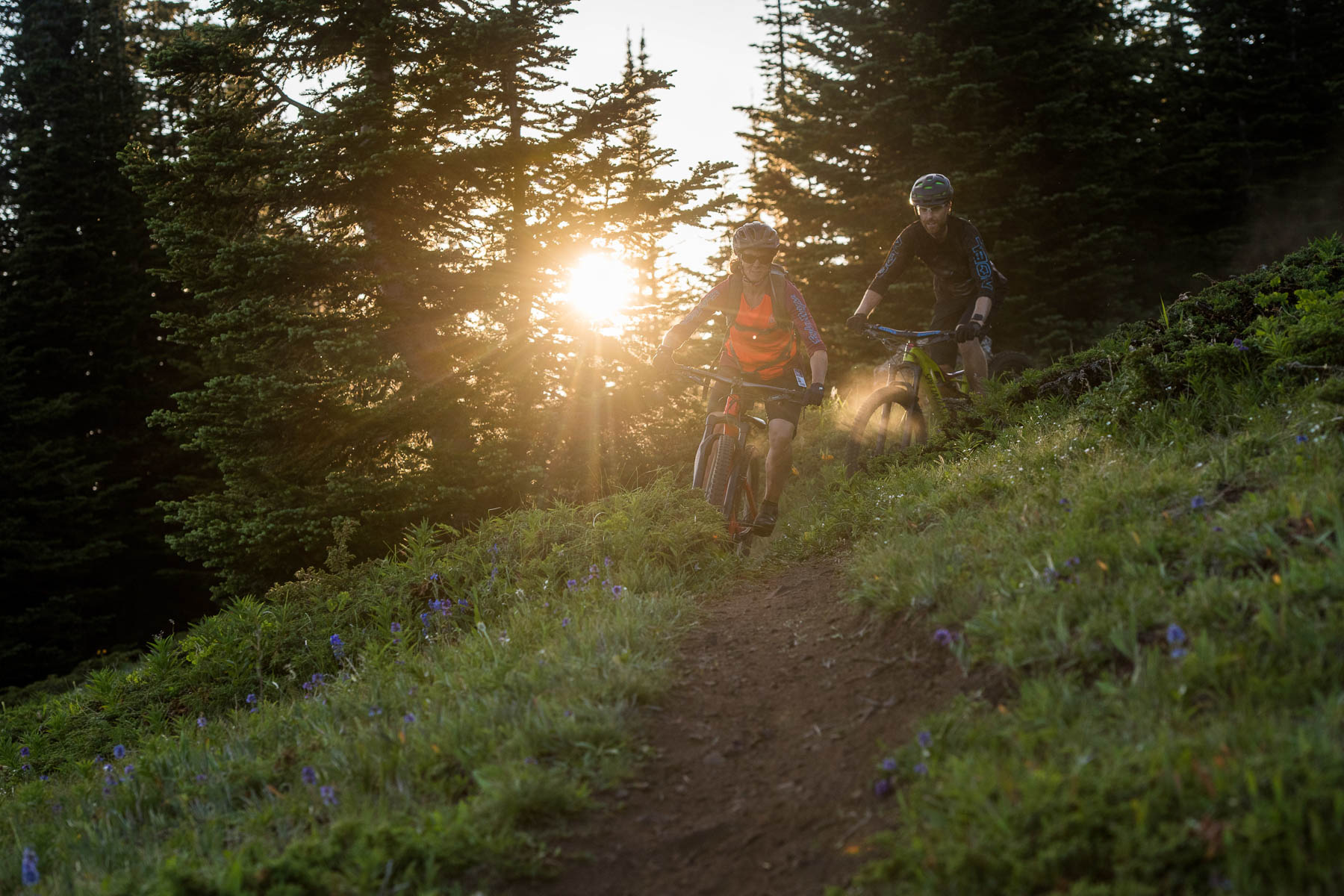 friends biking in sun peaks