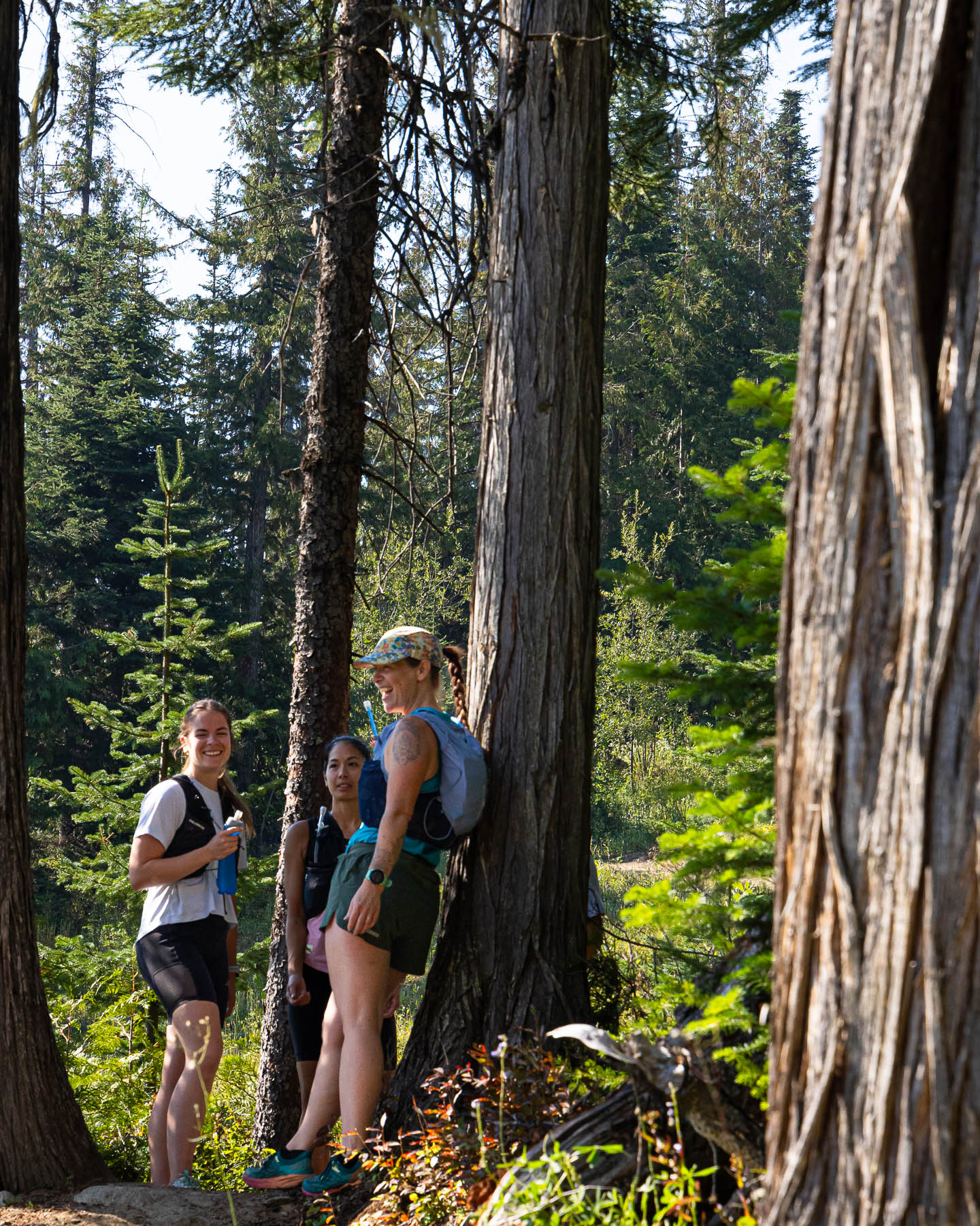 runners resting in forest