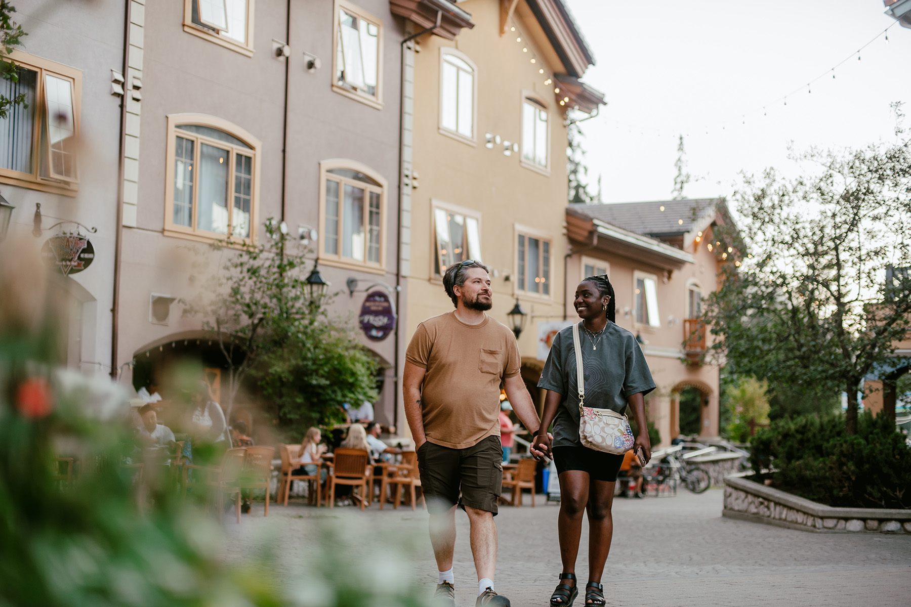 Couple walking through sun peaks village relaxed