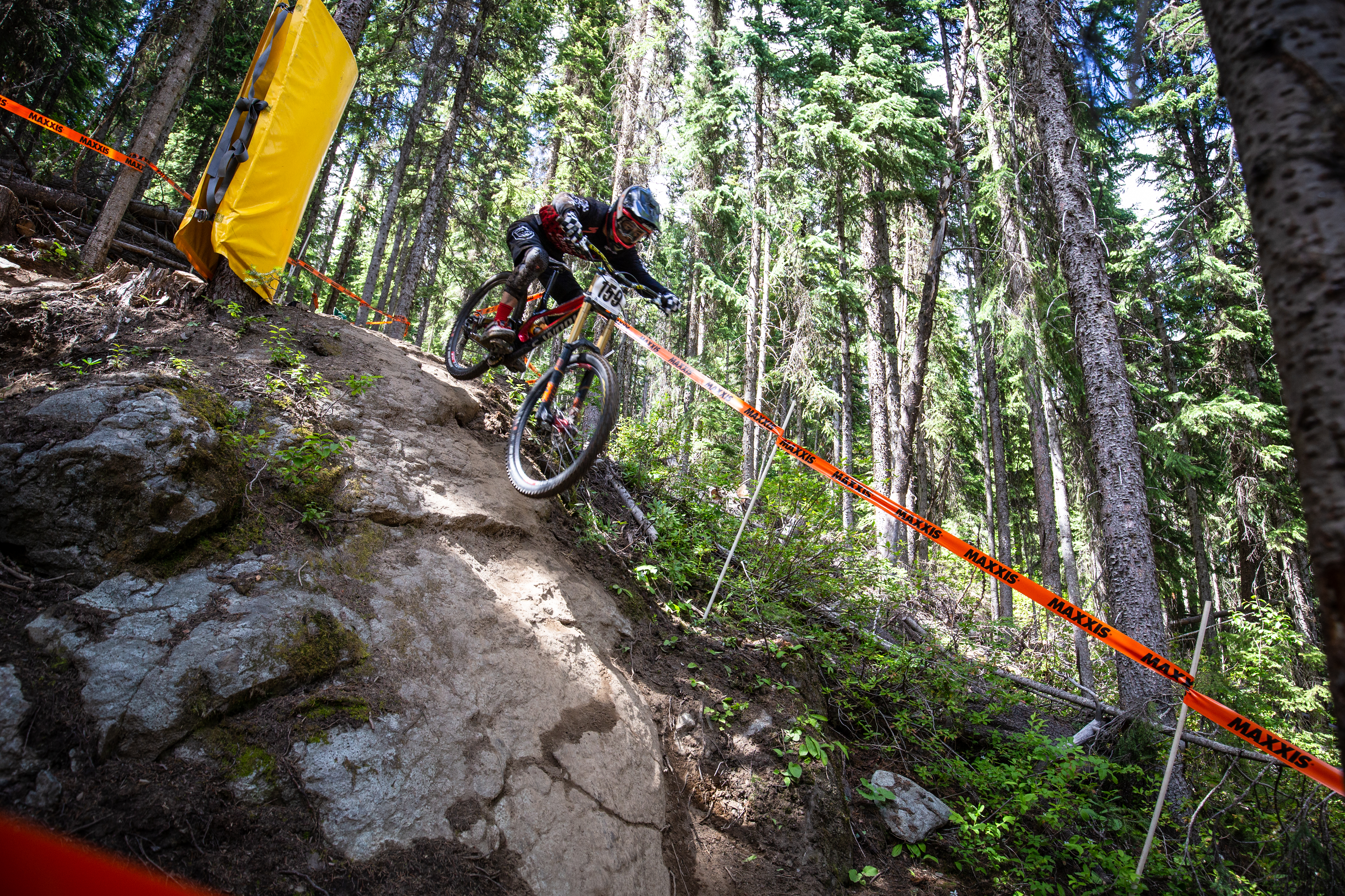 Mountain biker racing on a Downhill championship up at Sun Peaks Resort