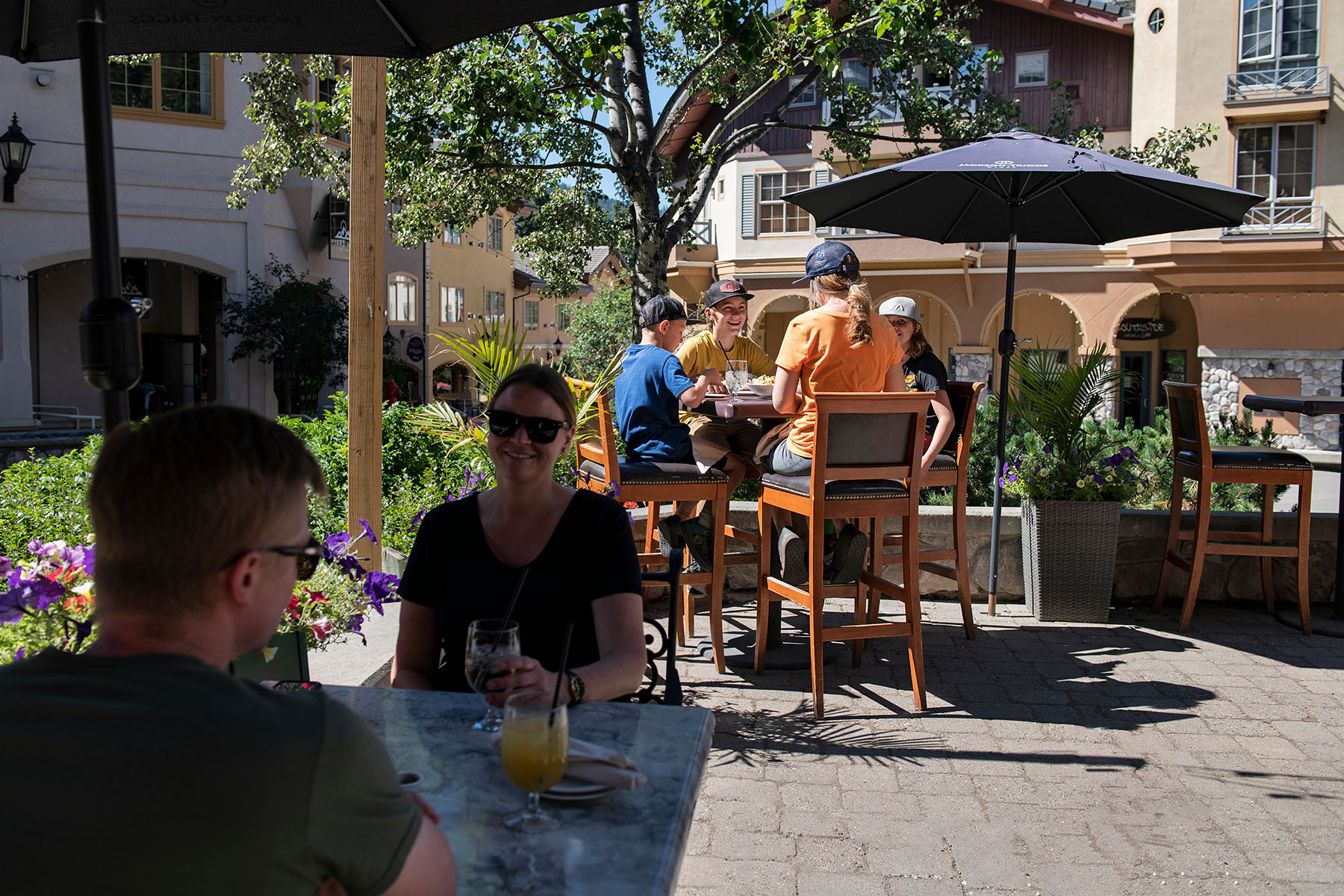 Two tables of families having brunch in sun peaks