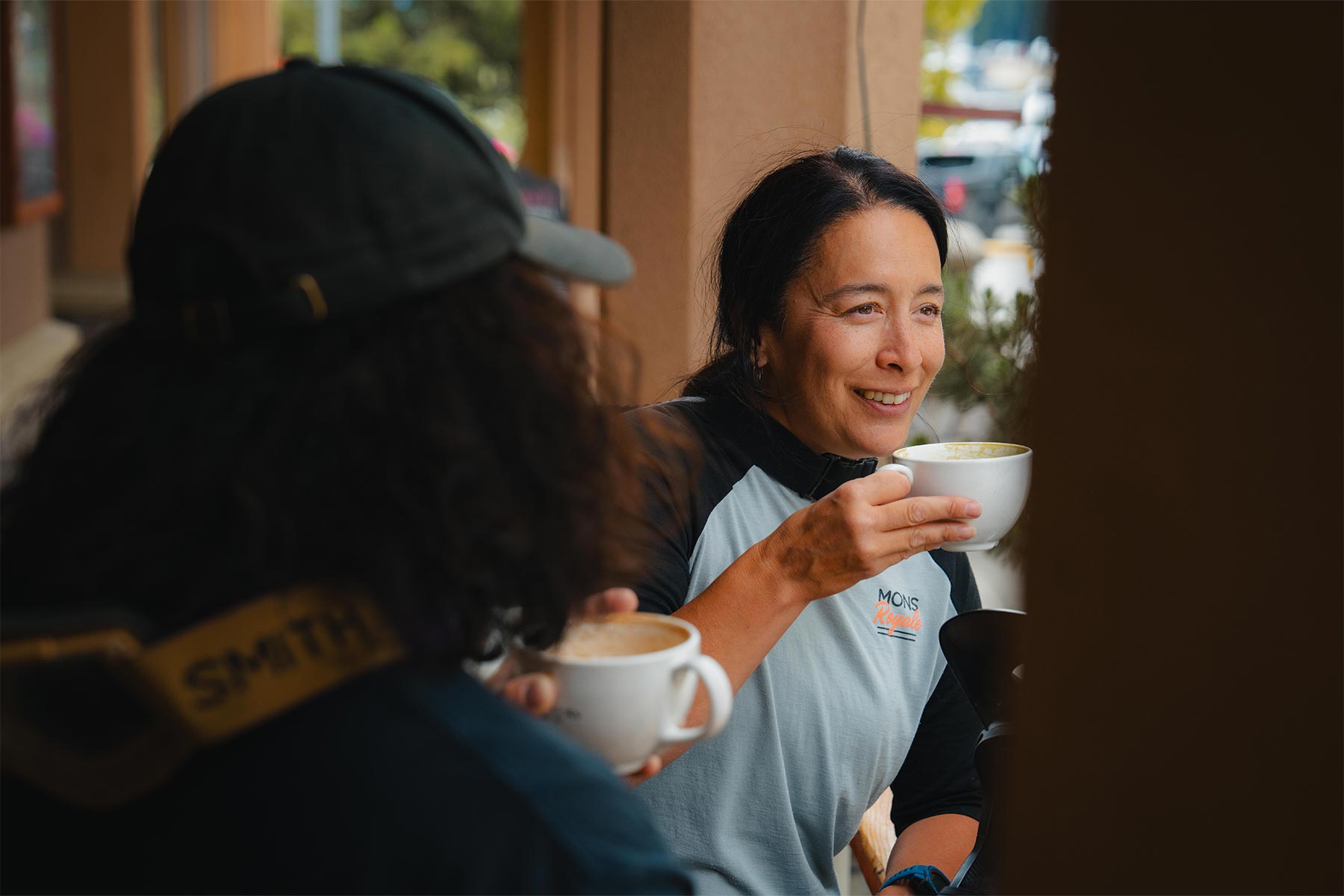 girl sipping coffee from a mug