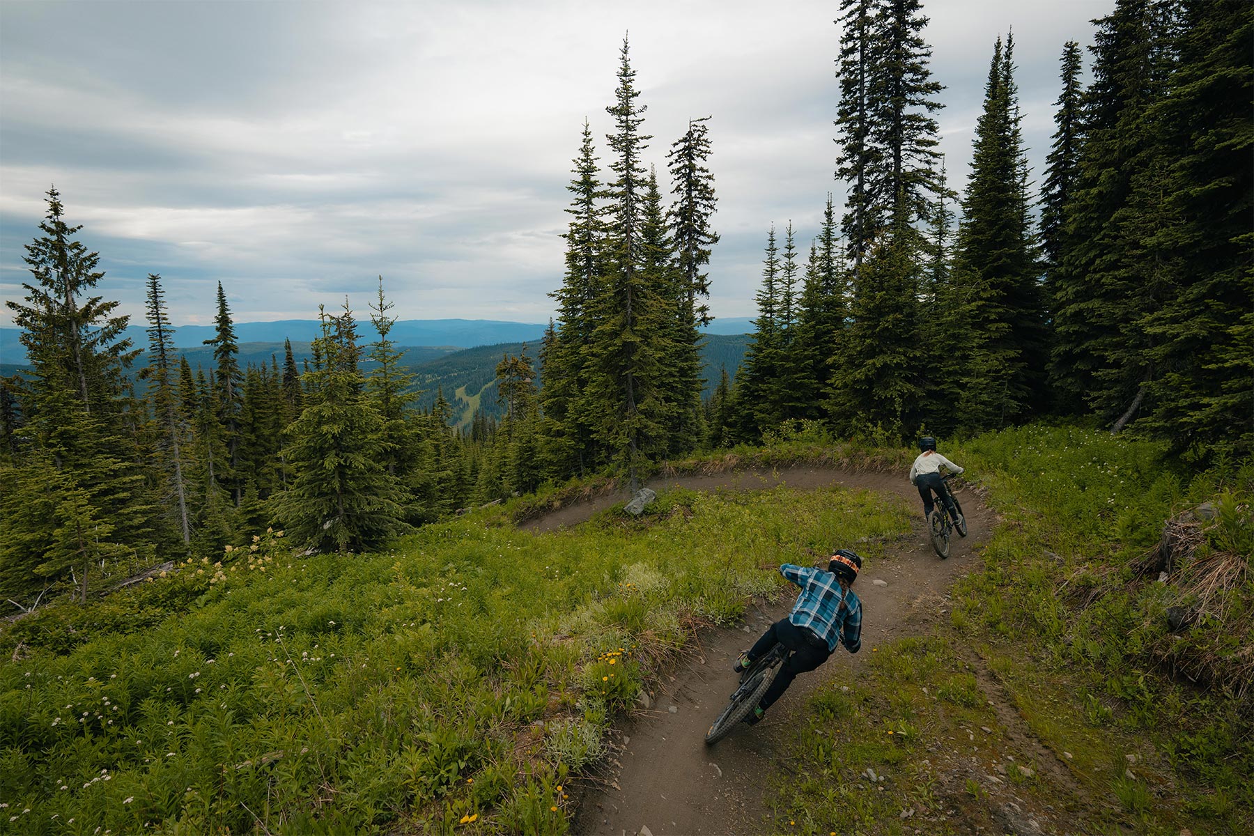 two bikers riding dh trails