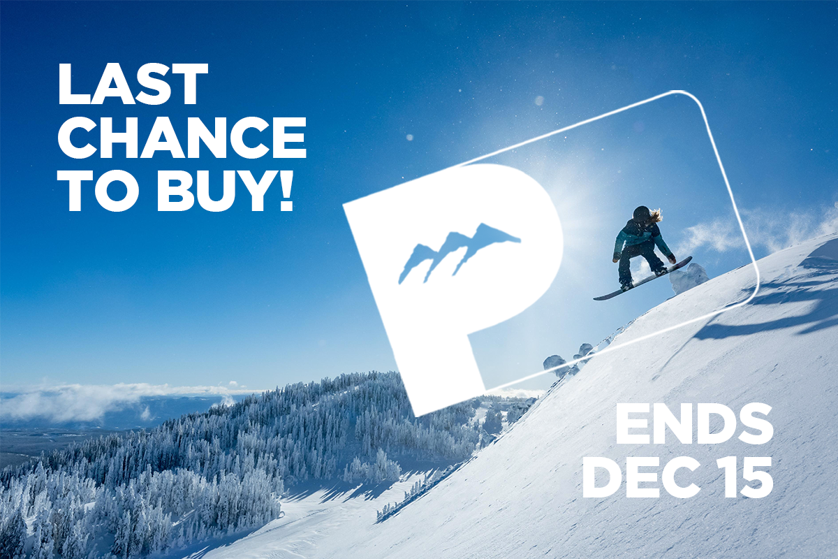 Snowboarder riding through powder with blue skies in the background and Peaks Card messaging